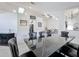 Stylish dining room with dark furniture and a modern light fixture, open to other living spaces at 1125 Almond Tree Cir, Orlando, FL 32835