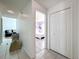 Hallway view showcases a bedroom with wood floors and light colored walls, and the living room at 1125 Almond Tree Cir, Orlando, FL 32835