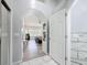 Hallway with a view into an elegant bedroom and luxurious bathroom, creating seamless transition at 1125 Almond Tree Cir, Orlando, FL 32835