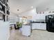 Bright kitchen features white cabinetry, a breakfast nook, and access to the outdoor patio area at 1125 Almond Tree Cir, Orlando, FL 32835