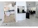 Open kitchen layout connects to dining area with tile floors and breakfast bar at 1125 Almond Tree Cir, Orlando, FL 32835
