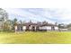 Charming single-story home with well-manicured lawn and lush landscaping creating great curb appeal at 18623 Tunbridge St, Orlando, FL 32833