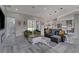 Open-concept living area boasts stylish furnishings, recessed lighting, and seamless indoor-outdoor flow at 18623 Tunbridge St, Orlando, FL 32833