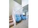 Bright foyer with a staircase, decorative chairs, and tasteful decor creating a welcoming entrance at 1929 Nice Ct, Kissimmee, FL 34747