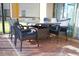 Covered patio area with outdoor dining furniture, great for entertaining and relaxing outdoors at 1929 Nice Ct, Kissimmee, FL 34747