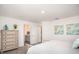 Bright bedroom with ensuite featuring a light color palette and stylish decor at 21 Locust Ter, Ocala, FL 34472