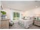 Beautiful bedroom with natural light, comfortable bed, and elegant furnishings at 21 Locust Ter, Ocala, FL 34472