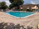 Community pool showcasing blue water and brick deck at 2525 Caper Ln # 205, Maitland, FL 32751