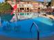 Community pool view of the apartments featuring well-maintained landscaping and blue water at 2525 Caper Ln # 205, Maitland, FL 32751