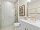 Modern bathroom with white marble tile shower, gold fixtures, and a white vanity at 2752 Fiddle Leaf Lp Ave, Apopka, FL 32712