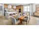 Spacious kitchen with island flows to dining area features stylish seating and elegant décor at 2752 Fiddle Leaf Lp Ave, Apopka, FL 32712