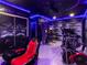 Game room in home basement with game chairs, arcade games, and fitness equipment at 3211 Sunrise Walk, Kissimmee, FL 34747