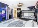 A bedroom designed with Star Wars theme, featuring bunk beds and a themed mural at 3211 Sunrise Walk, Kissimmee, FL 34747