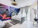 Unique bedroom featuring Star Wars theme, decor and accent lighting plus door to outdoor pool at 3211 Sunrise Walk, Kissimmee, FL 34747