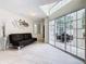 Bright living room with large windows, featuring a comfortable sofa and modern décor, offering a relaxing space at 3211 Sunrise Walk, Kissimmee, FL 34747
