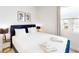 The primary bedroom features large bed, lamps on both sides, and window at 359 Famagusta Dr, Davenport, FL 33896