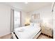 Bright bedroom with a king bed, hardwood floors, and elegant decor at 359 Famagusta Dr, Davenport, FL 33896