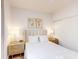 Bright bedroom with a king bed, hardwood floors, and lamps on night stands at 359 Famagusta Dr, Davenport, FL 33896