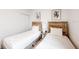 Comfortable bedroom with two beds, providing ample sleeping space and wooden headboards at 359 Famagusta Dr, Davenport, FL 33896