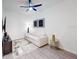 Cozy living room with a soft sofa, ceiling fan, modern furniture, and hardwood floors at 359 Famagusta Dr, Davenport, FL 33896