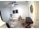 Comfortable living room with a ceiling fan, desk, modern furniture, and hardwood floors at 359 Famagusta Dr, Davenport, FL 33896