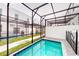 Private screened-in pool and a grass area surrounded by an enclosed lanai at 359 Famagusta Dr, Davenport, FL 33896