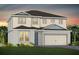 Charming two-story home featuring a covered entrance, two-car garage, and landscaped front yard at 5542 Settlingstone Ln, St Cloud, FL 34771