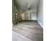 Spacious bedroom featuring wood look flooring, ceiling fan and double closets at 5953 Westgate Dr # 1821, Orlando, FL 32835