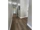 Hallway showcasing wood-look flooring and neutral walls at 5953 Westgate Dr # 1821, Orlando, FL 32835