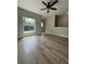 Spacious living room featuring wood-look flooring and an open concept design at 5953 Westgate Dr # 1821, Orlando, FL 32835