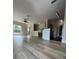 Open concept living space with wood-look flooring, a ceiling fan, and natural light at 5953 Westgate Dr # 1821, Orlando, FL 32835