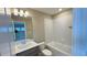 Bathroom featuring a tub, single sink vanity, and tiled walls at 6221 Argent Wood Dr, Winter Garden, FL 34787
