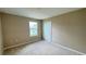 Cozy bedroom featuring neutral tones, carpet flooring, closet, and a well-lit window at 6221 Argent Wood Dr, Winter Garden, FL 34787
