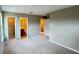 Carpeted bedroom leading to a bathroom and walk-in closet at 6221 Argent Wood Dr, Winter Garden, FL 34787