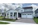Charming two-story home with a two-car garage and inviting covered entry at 6221 Argent Wood Dr, Winter Garden, FL 34787