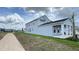 Front exterior showcasing the two-car garage, driveway, and covered porch at 6221 Argent Wood Dr, Winter Garden, FL 34787