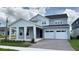 Charming two-story home with a two-car garage and inviting covered entry at 6221 Argent Wood Dr, Winter Garden, FL 34787