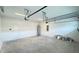 Clean two car garage featuring a water heater and electrical panel at 6221 Argent Wood Dr, Winter Garden, FL 34787
