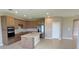 Open kitchen featuring stainless steel appliances and a large center island at 6221 Argent Wood Dr, Winter Garden, FL 34787