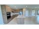 Open kitchen featuring stainless steel appliances and a large center island at 6221 Argent Wood Dr, Winter Garden, FL 34787