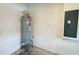 Water heater and circuit breaker in utility room with exposed block walls at 6221 Argent Wood Dr, Winter Garden, FL 34787