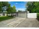 Charming home featuring a well-kept lawn, white fence, and attached garage at 654 Romano Ave, Orlando, FL 32807