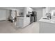 Open-concept kitchen with modern appliances and seamless flow into the living areas at 654 Romano Ave, Orlando, FL 32807