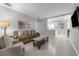 Inviting living room with neutral tones, tile flooring, and abundant natural light at 654 Romano Ave, Orlando, FL 32807