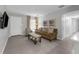 Bright living room featuring tile floors, neutral tones, and easy access to the entry door at 654 Romano Ave, Orlando, FL 32807