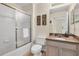 Well-maintained bathroom featuring a shower-tub combo with sliding glass doors, and a neutral color palette at 962 Park Terrace Cir, Kissimmee, FL 34746