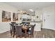 Elegant dining area featuring an eye-catching pendant light and seating for six, perfect for gatherings at 962 Park Terrace Cir, Kissimmee, FL 34746