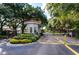 Gated community entrance with a charming guardhouse and meticulously maintained landscaping, ensuring security and curb appeal at 962 Park Terrace Cir, Kissimmee, FL 34746