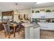 Open kitchen concept with island seating flows into the dining area, creating a seamless living space at 962 Park Terrace Cir, Kissimmee, FL 34746