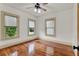 Comfortable bedroom featuring original hardwood floors, neutral paint, and a ceiling fan at 1013 W 20Th St, Sanford, FL 32771
